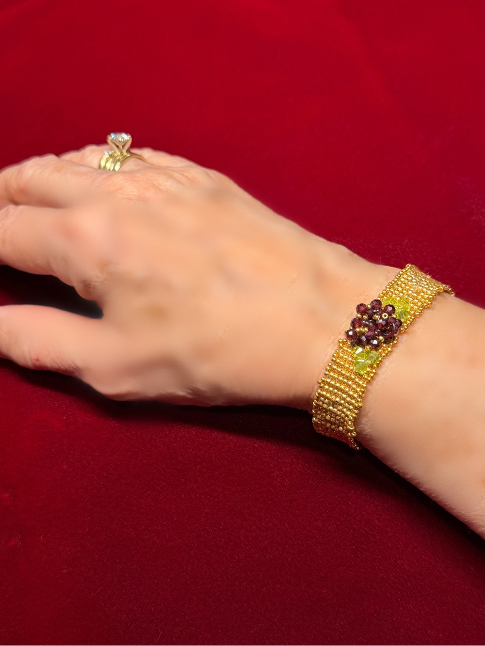Hand woven gold color seed bead bracelet with garnet and crystal floral accent - Picture 3 of 8
